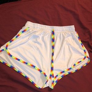 Women’s white and rainbow striped comfortable shorts.